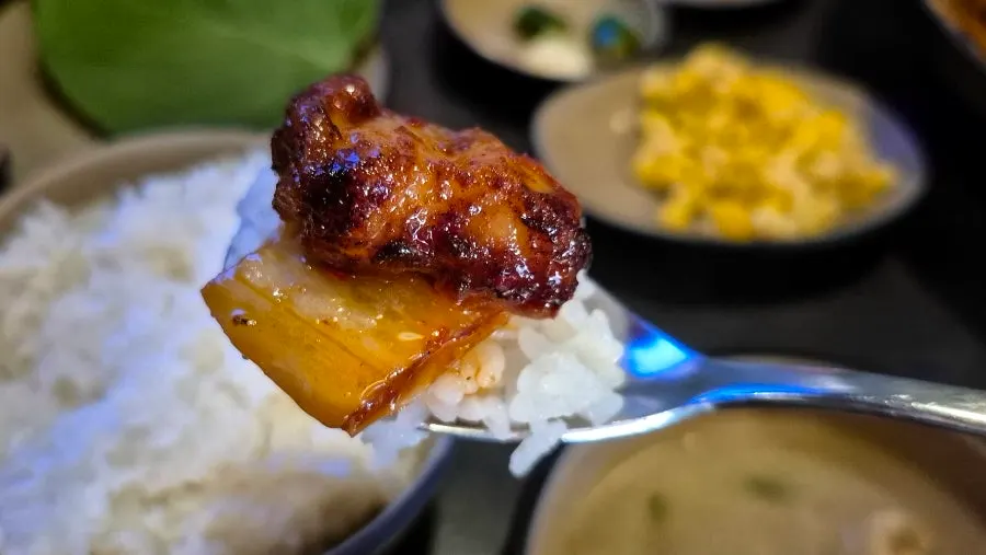 Pork belly and grilled kimchi over rice