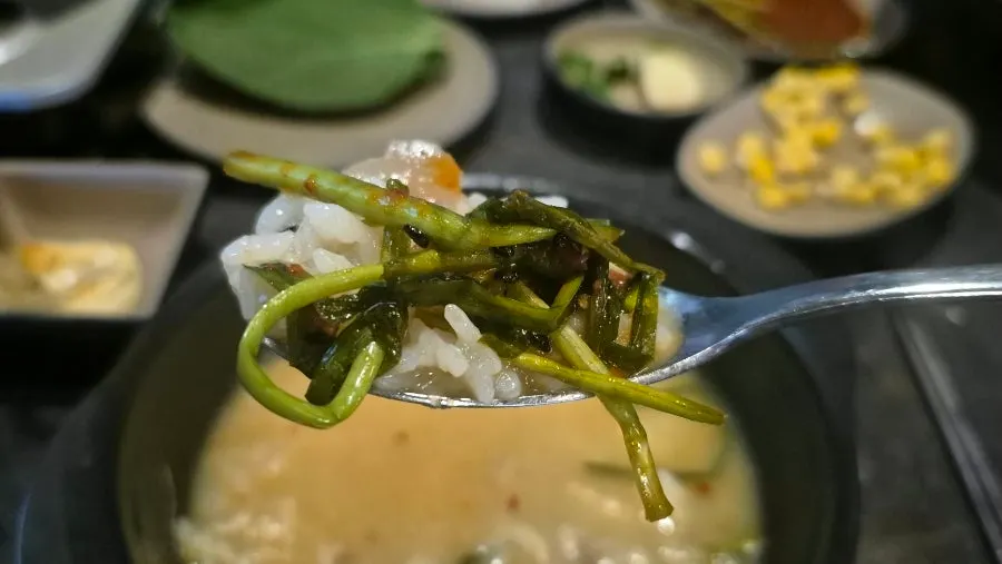 Hot pot broth with rice and seasoned chives