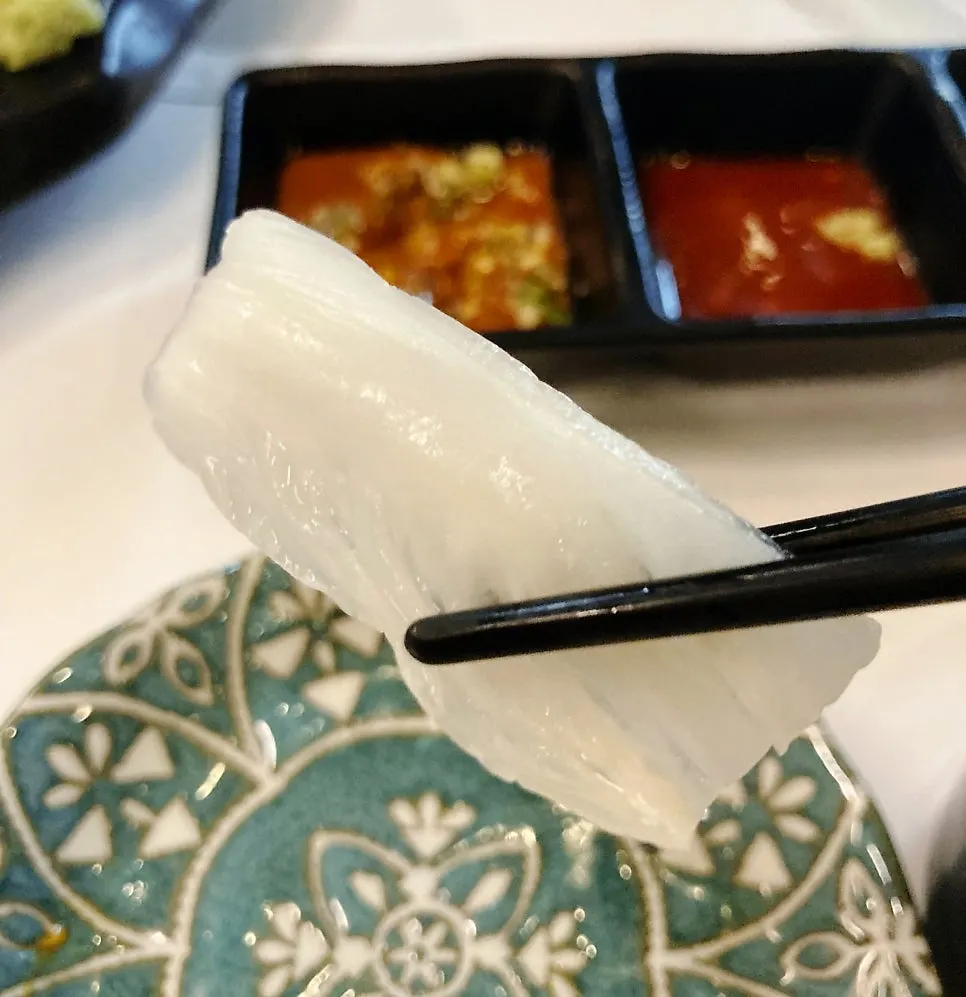 Haeseon white kimchi served with aged sashimi