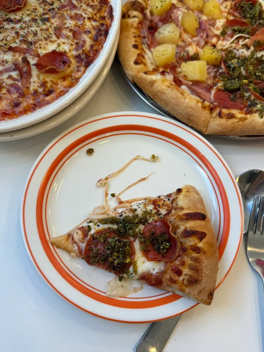 A cheese-loaded slice of pizza from Sunny's Pizza Market