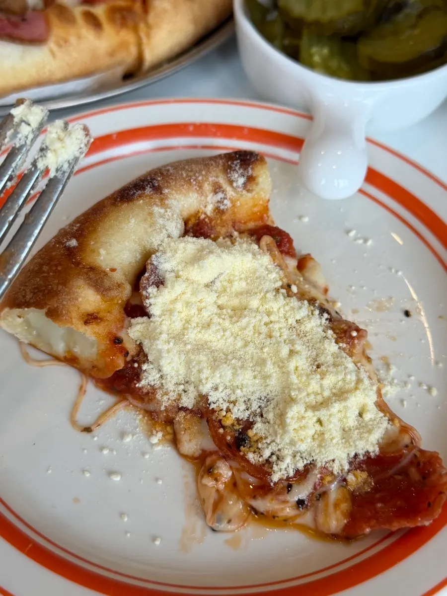 A combination pizza slice plated