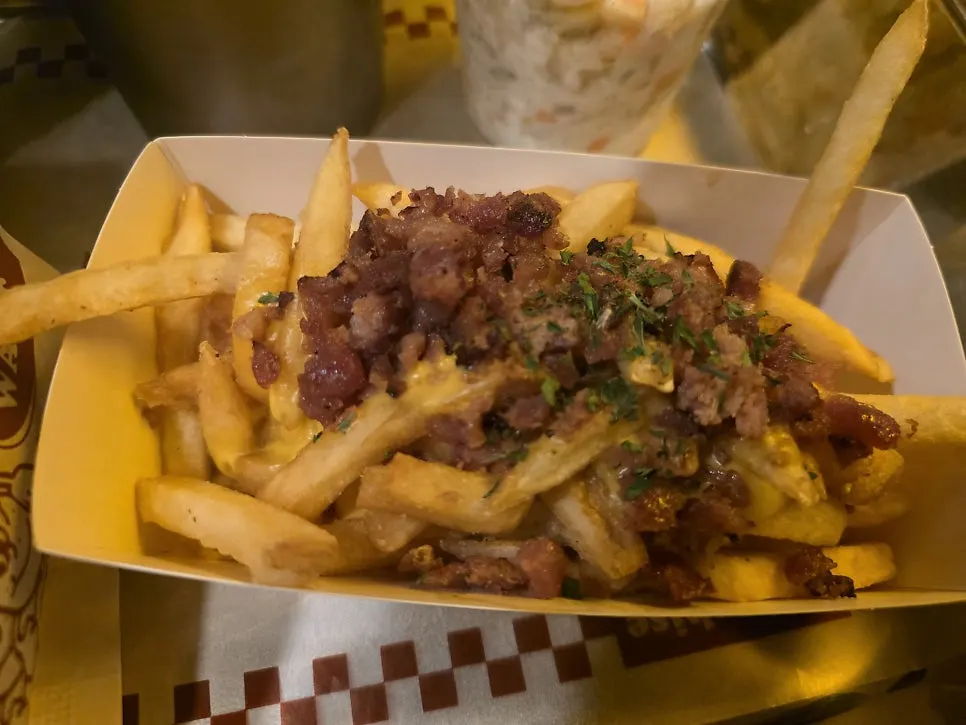 Cheese bacon fries served alongside the burgers