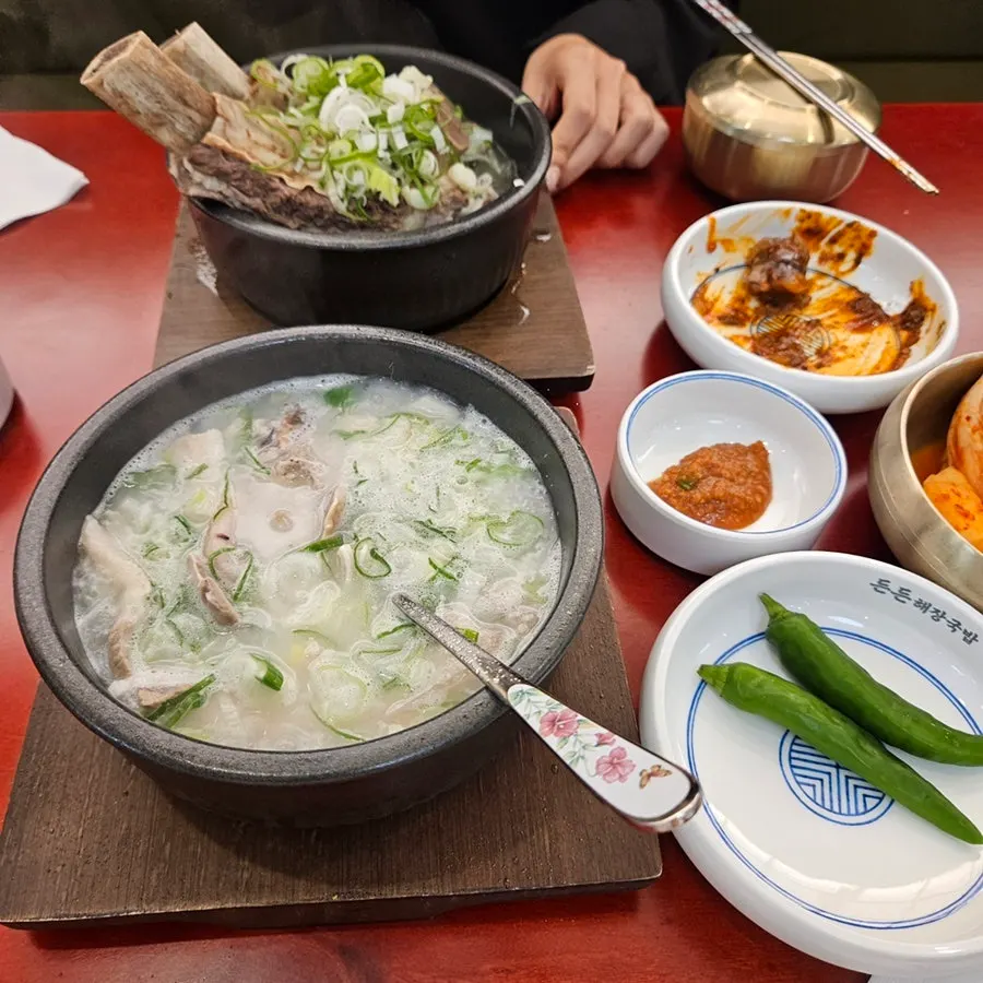 Two bowls of pork gukbap and gointol galbitang served together