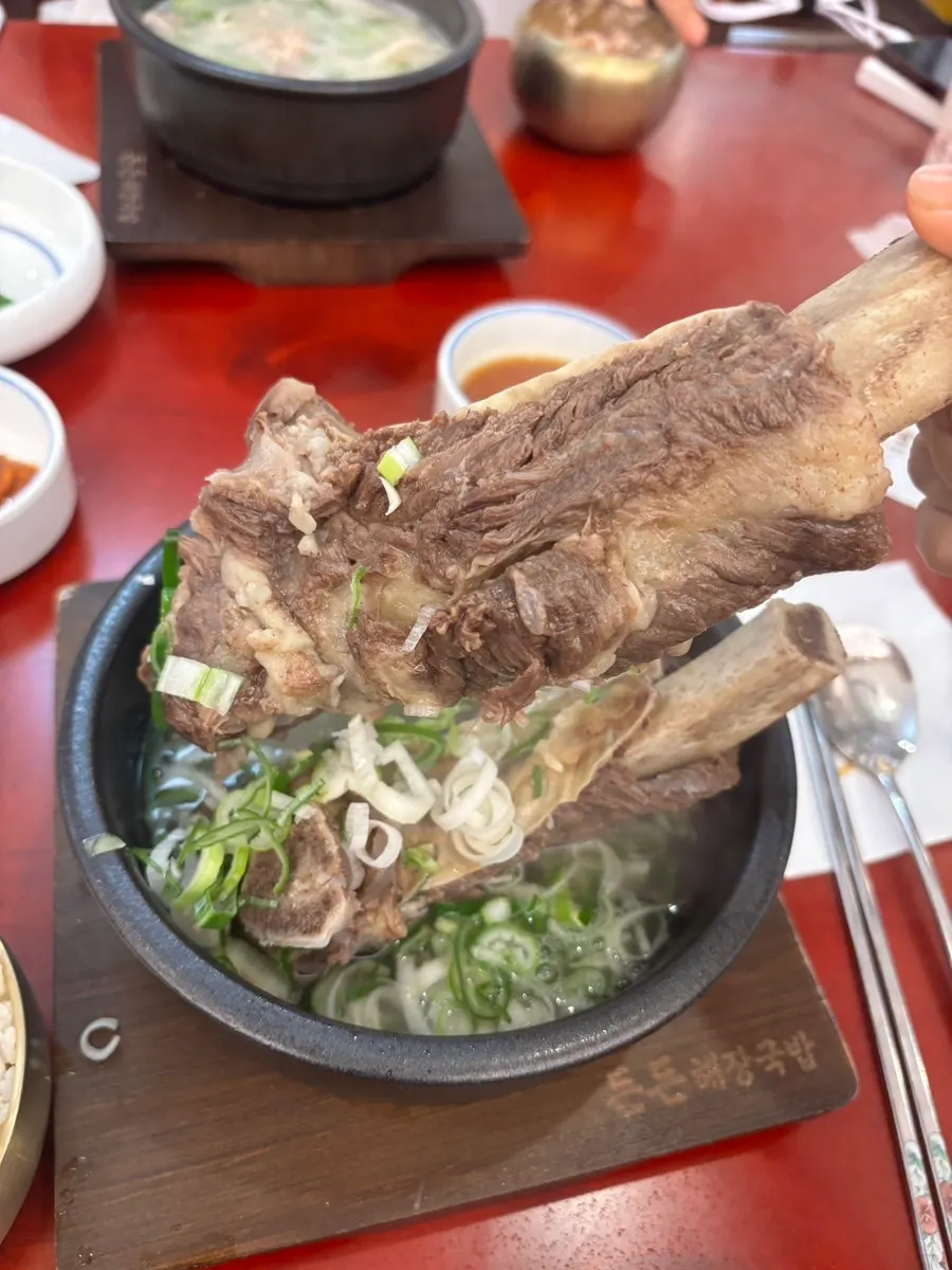 Tender meat lifted from the light galbitang broth