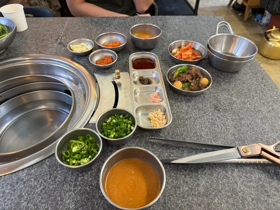 Table setting with lettuce wraps and sauces