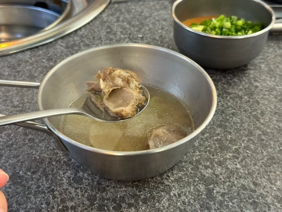 Hot pot-style soup served alongside the meal