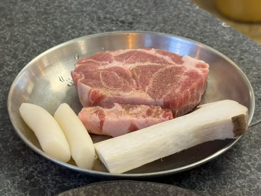 Iberico pork neck grilled with mushrooms and potatoes