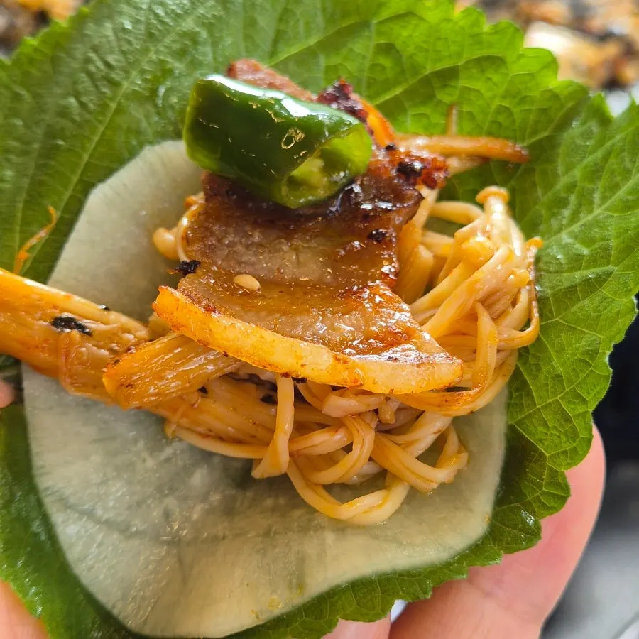 Pork belly topped with scallion salad