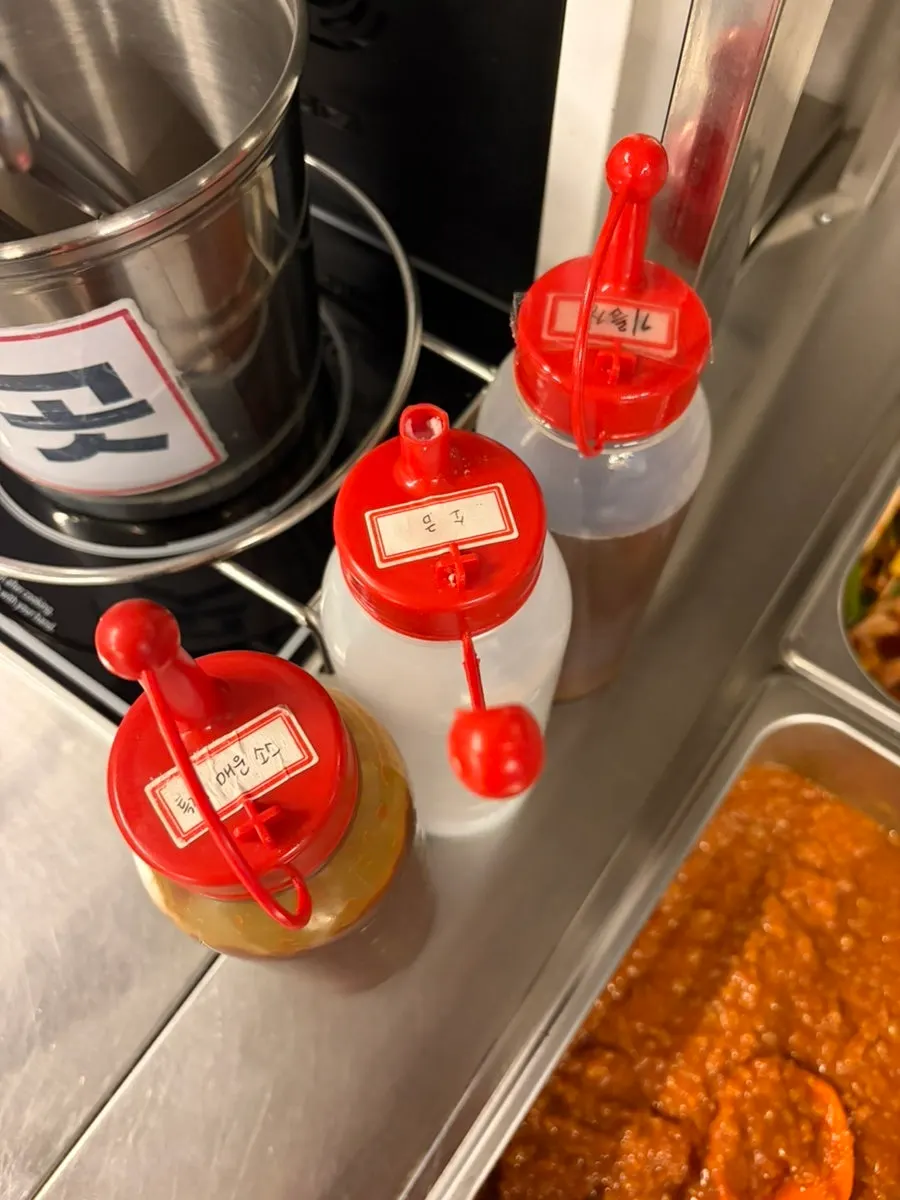 Sauce station with salt, oil sauce and house-made spicy sauce