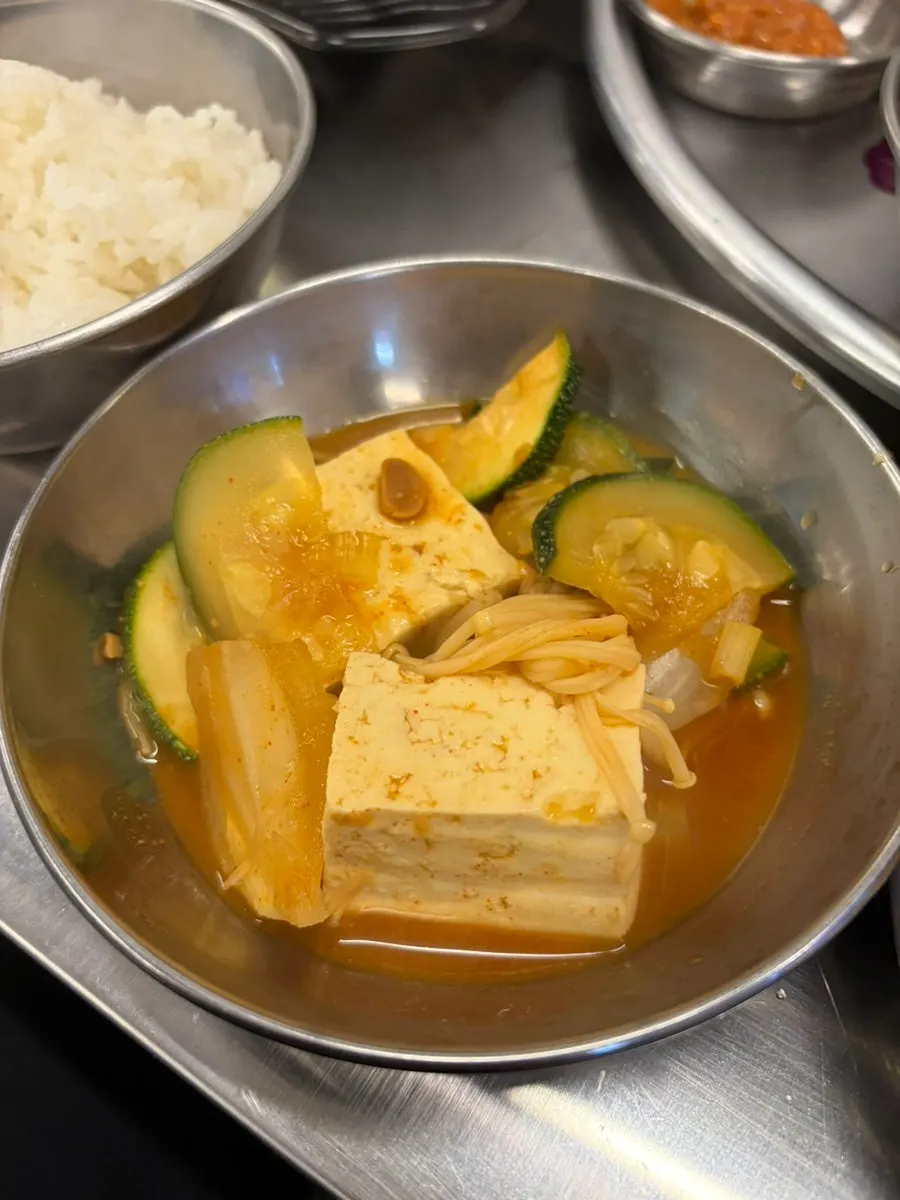 Bowl of rice served alongside doenjang jjigae