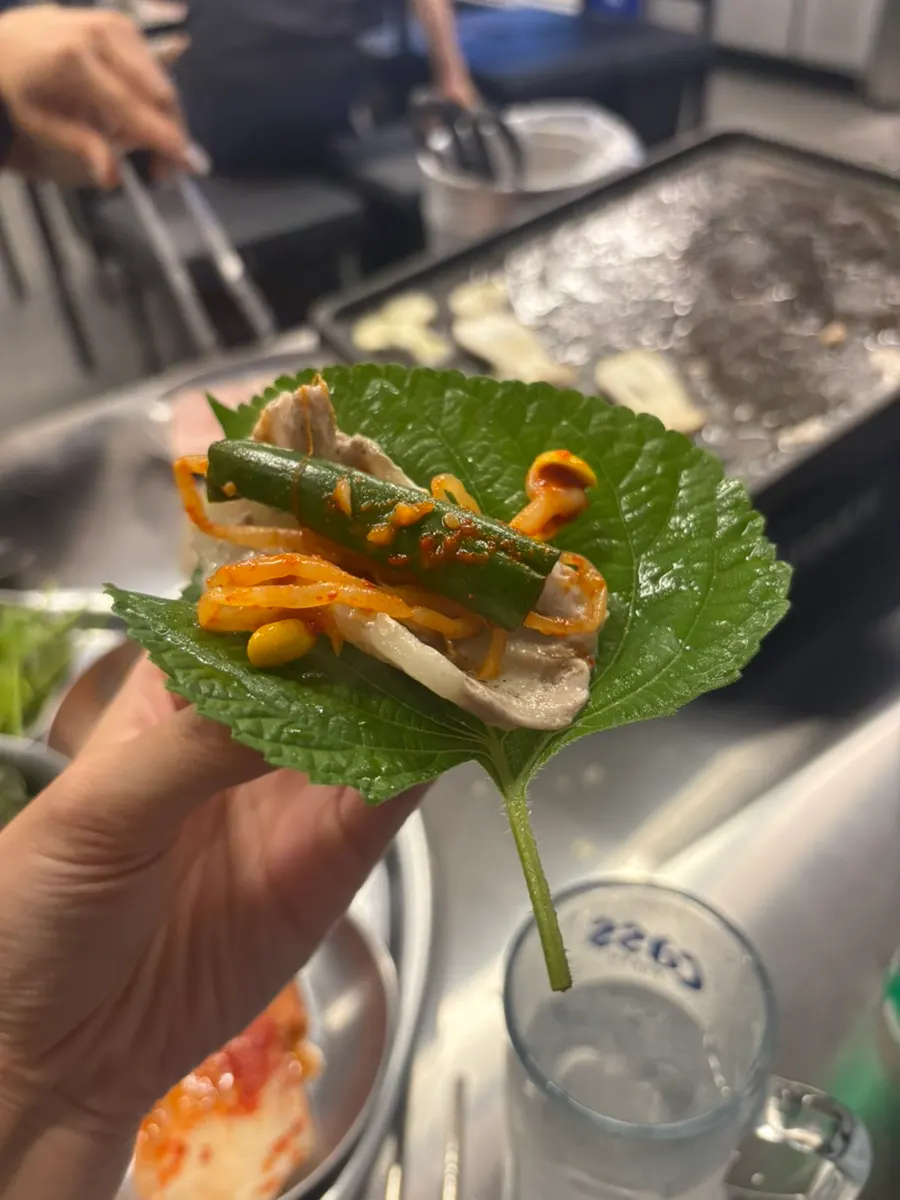 Frozen pork belly wrapped in a lettuce leaf
