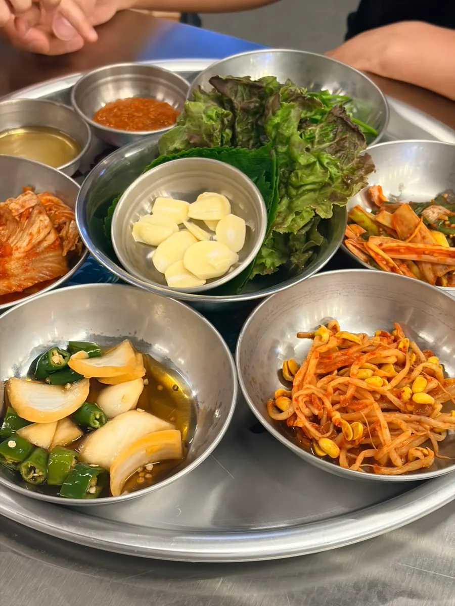Spread of lettuce, kimchi, garlic and shredded scallions