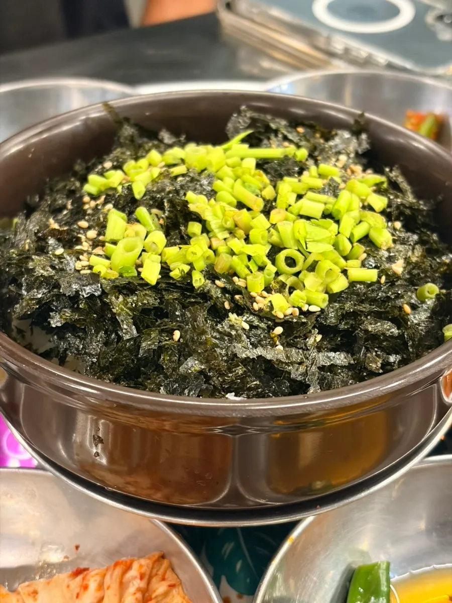 Kimchi fried rice being mixed on the grill