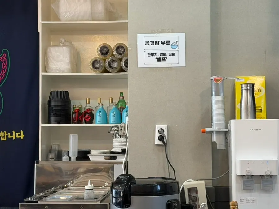 Unlimited rice self-serve corner with side dishes