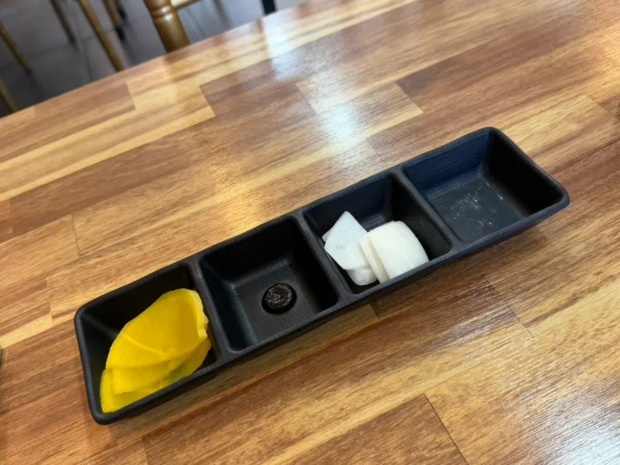 Soy sauce, vinegar, and red pepper flakes on the table