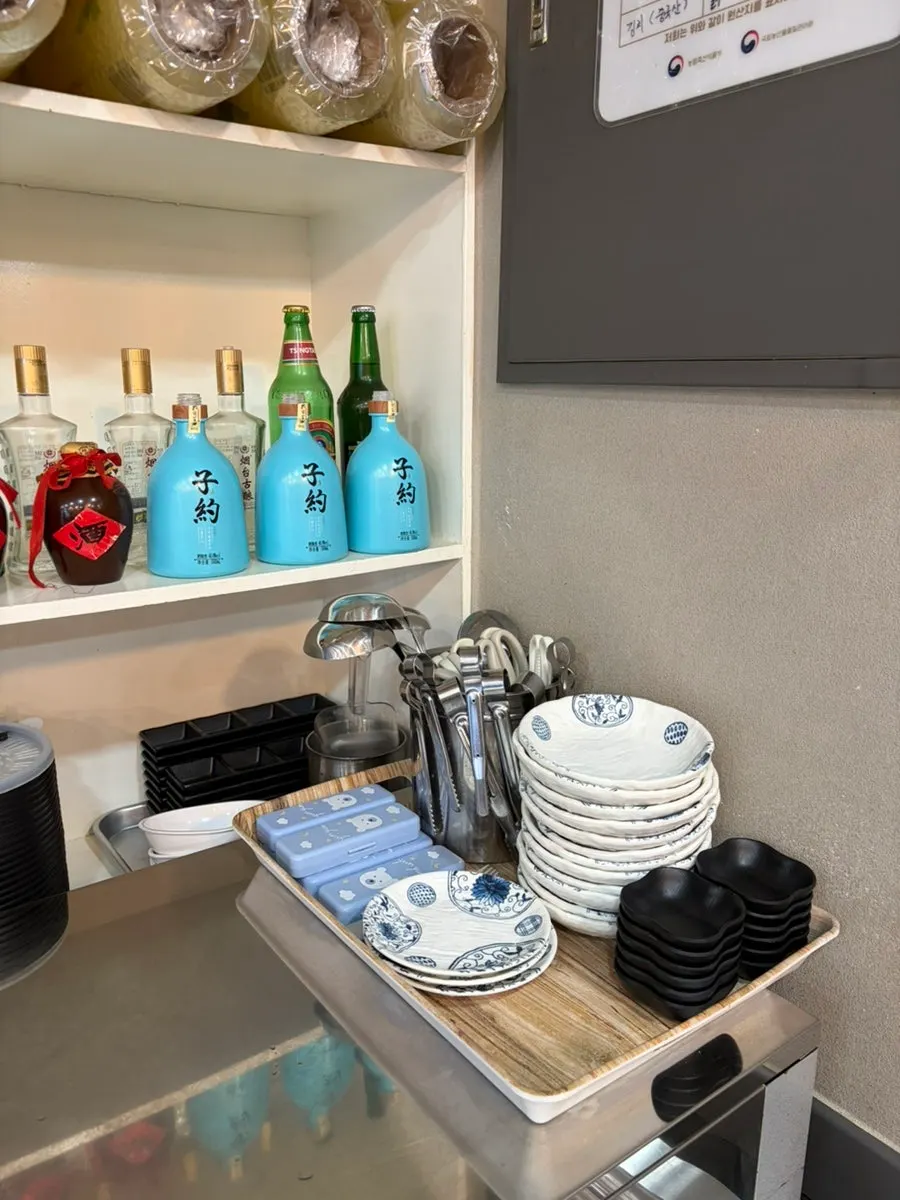 Self-serve corner with small plates and scissors