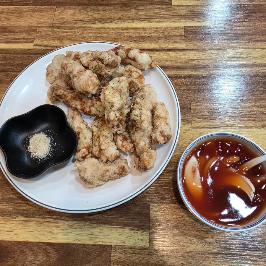 2-person set table setting with shrimp ganjajang, sundubu jjamppong and mini tangsuyuk
