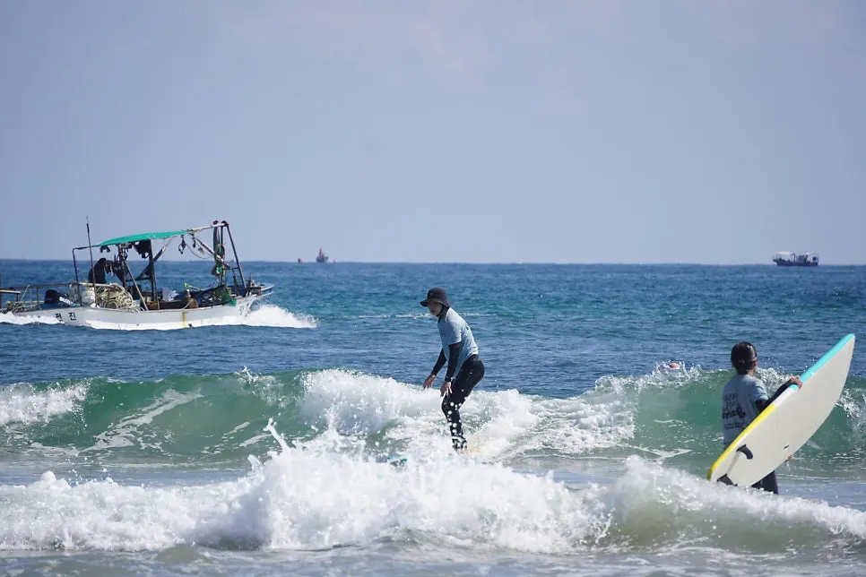 Waiting for wave timing during the surf lesson