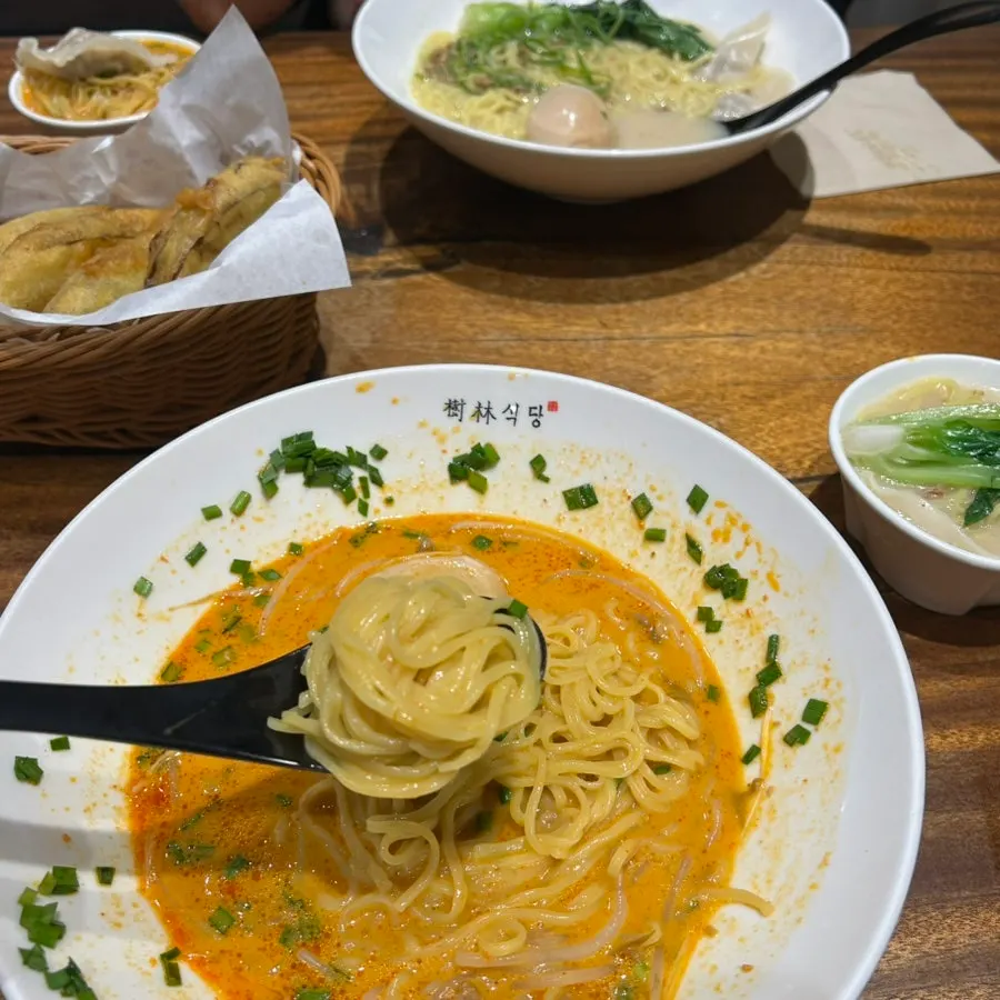 Close-up of dandan noodles and broth