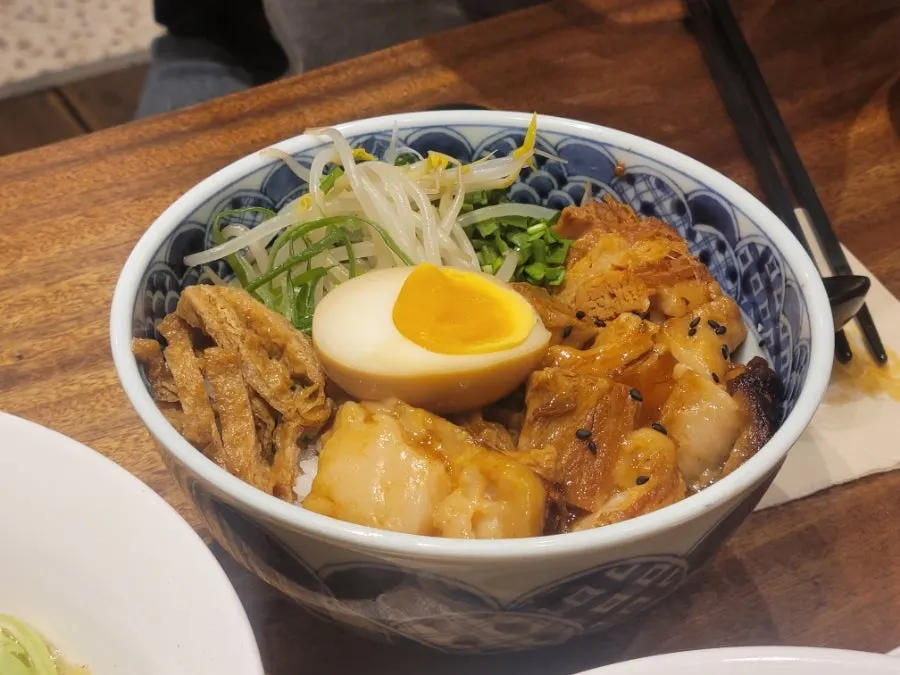 Dongpo pork rice bowl topped with pork belly and egg