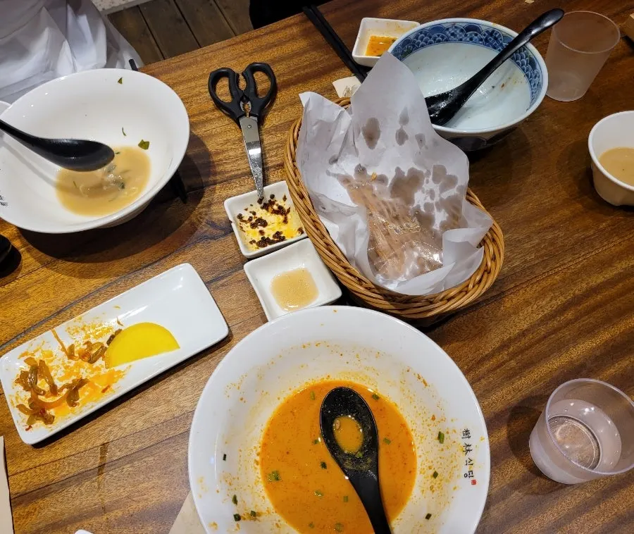 A table with bowls emptied down to the bottom