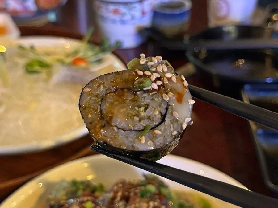 Close-up of seasoned rice maki with sesame seeds