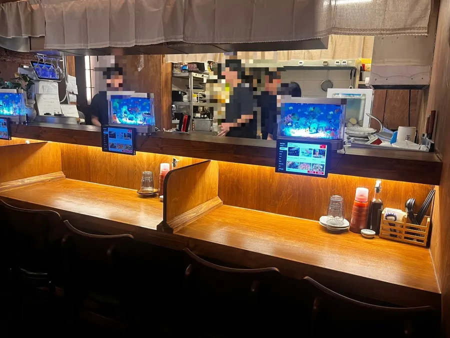 Bar counter seating facing the kitchen