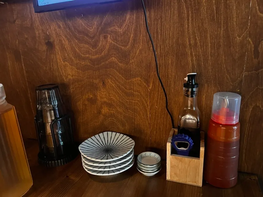 Barley tea bottle pitcher and small plates set on the table