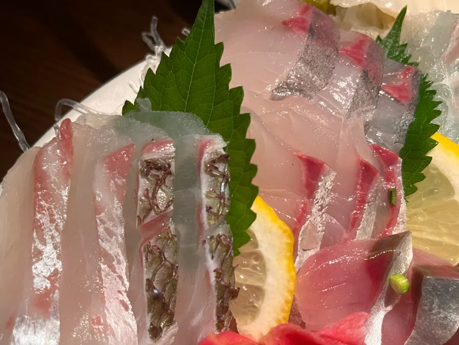 Plate of flounder, sea bass, and red seabream aged sashimi