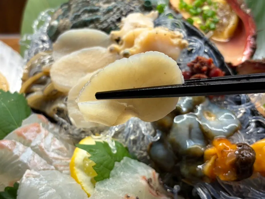 Picking up a piece of aged sashimi
