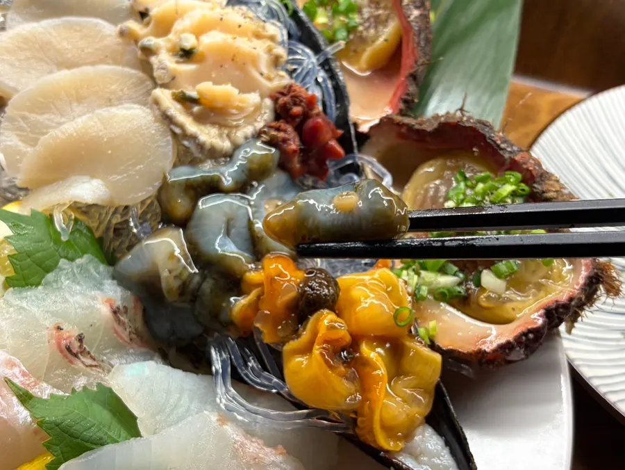A piece of aged sashimi paired with the highball