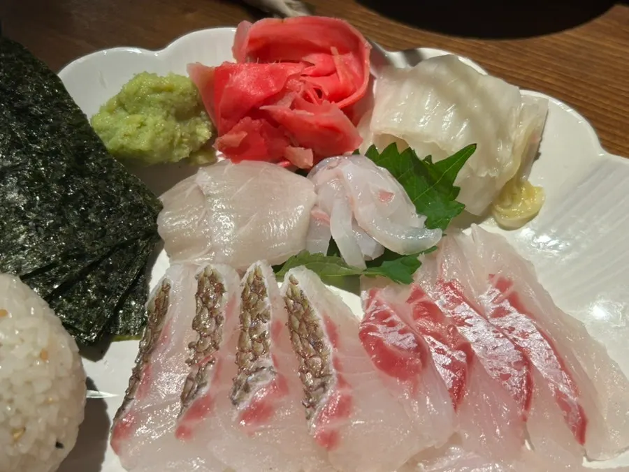 Fin cuts and torch-seared pieces of aged raw fish