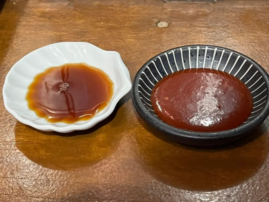 Table set with soy sauce and vinegar-chili sauce