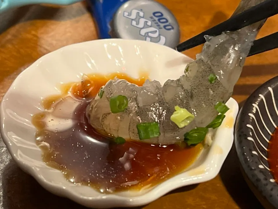 Raw shrimp sashimi topped with wasabi
