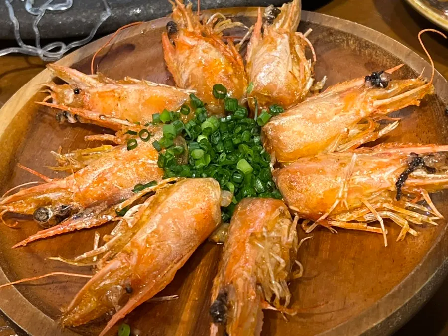 Dipping sauces served alongside the raw shrimp sashimi