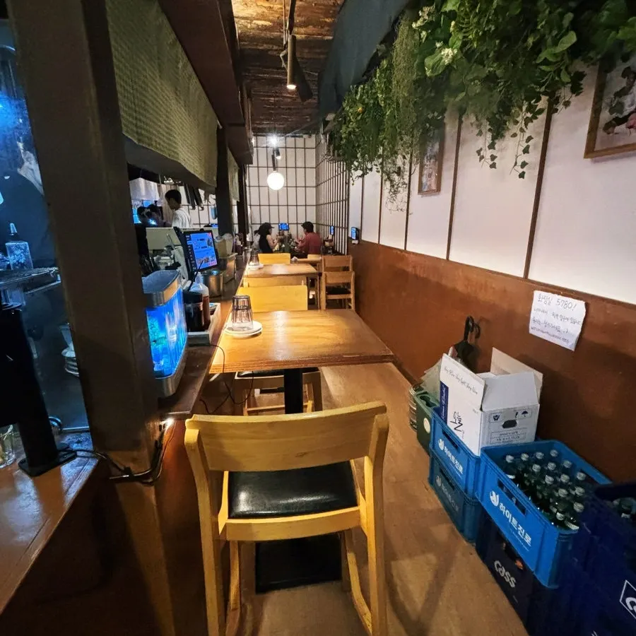 Two-person tables along the walkway at Susan Jang