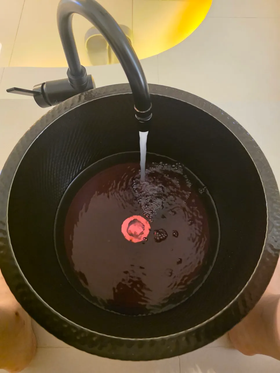 Soaking feet in warm water during the foot bath
