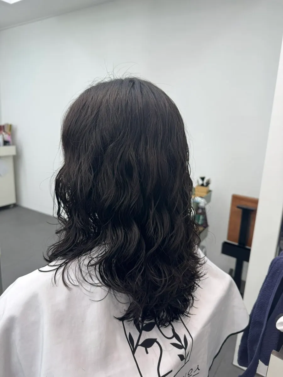 Finished medium-length hippie perm with curls