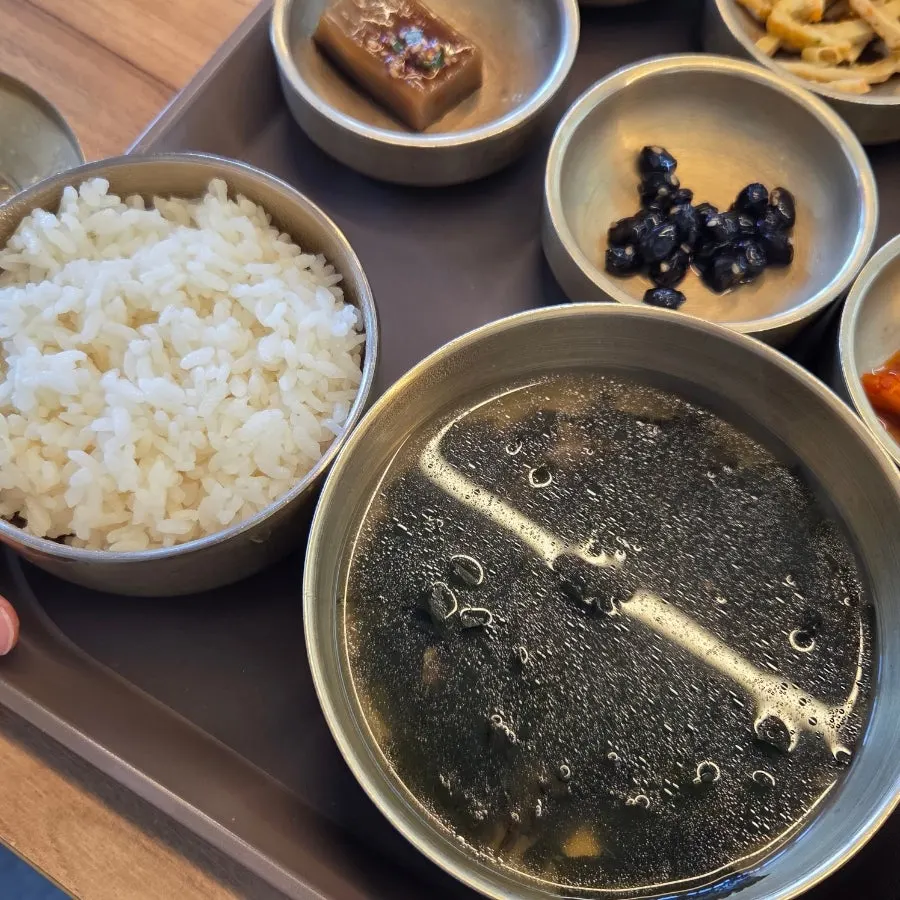 A bowl of rice and beef seaweed soup