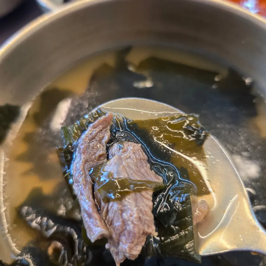 A bowl of beef seaweed soup with plenty of beef