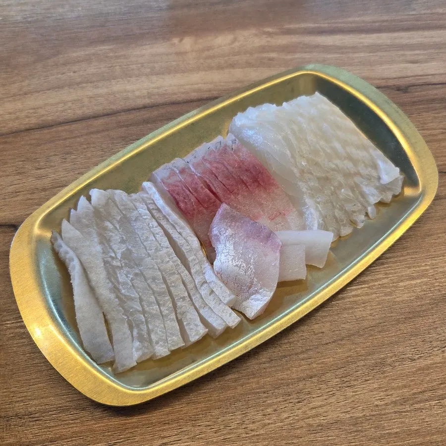 Three-fish combo sashimi served separately on a mini tray