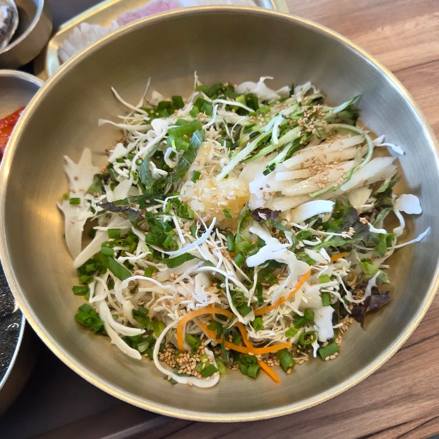 Sashimi for bibimbap cut into long strips and neatly plated