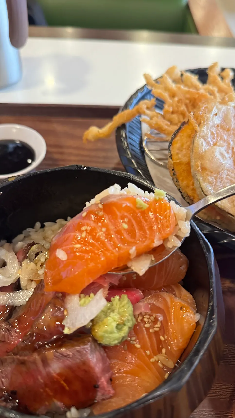 Rice bowl enjoyed with steak and raw salmon