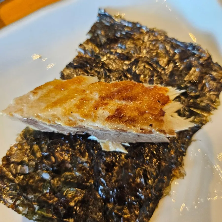 Warm wood-fired grilled mackerel on an induction burner