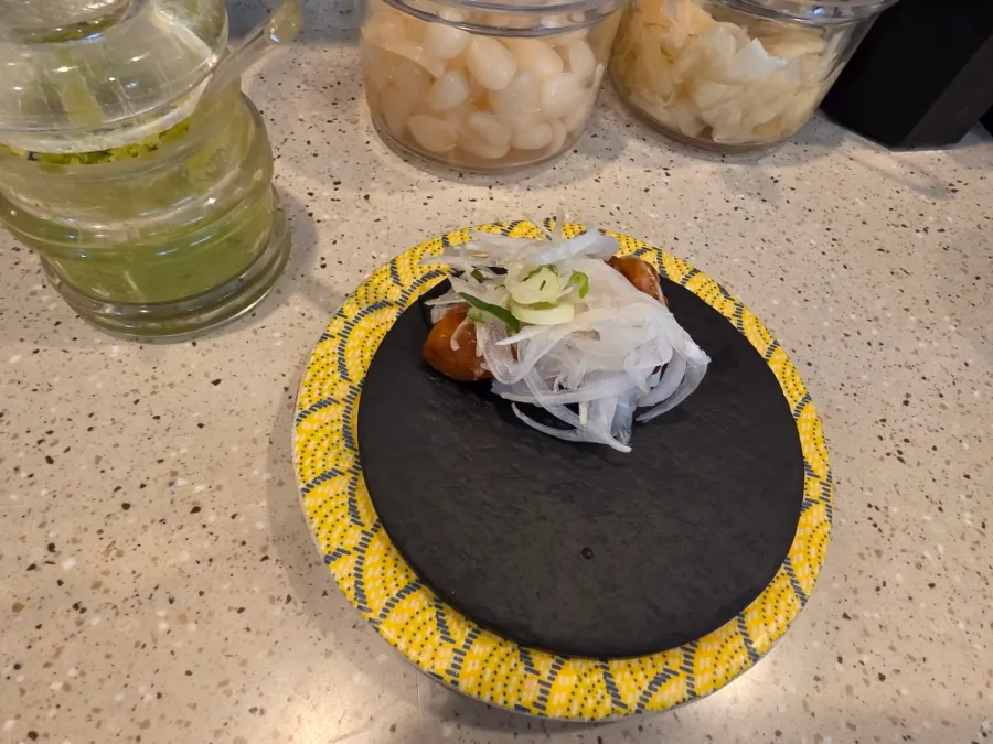 A plate of sushi with a good balance of topping and rice