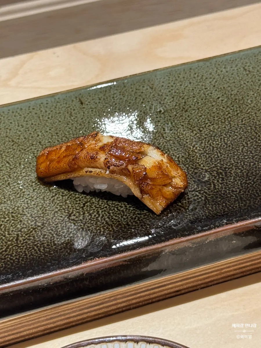Mackerel nigiri with shiso and ginger