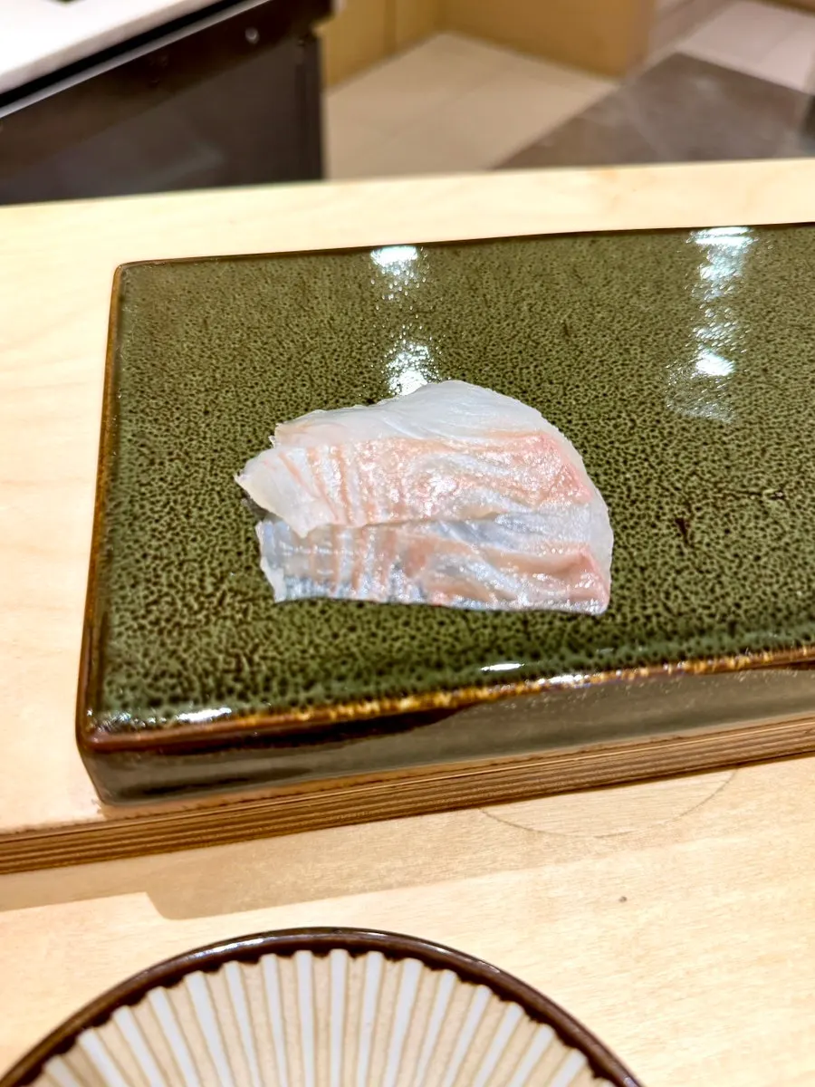 A piece of flounder sushi at Sushi Hibi