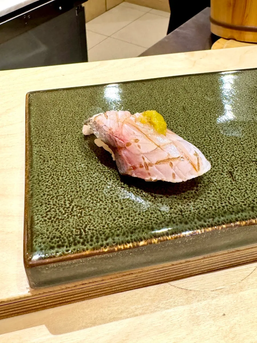 A dish topped with monkfish liver at Sushi Hibi