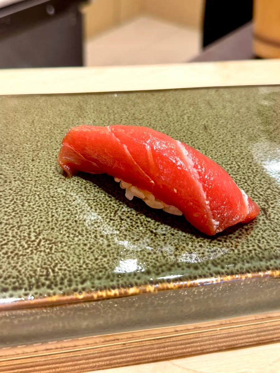 Torch-seared jaetbangeo (amberjack) sushi with yuzu sauce