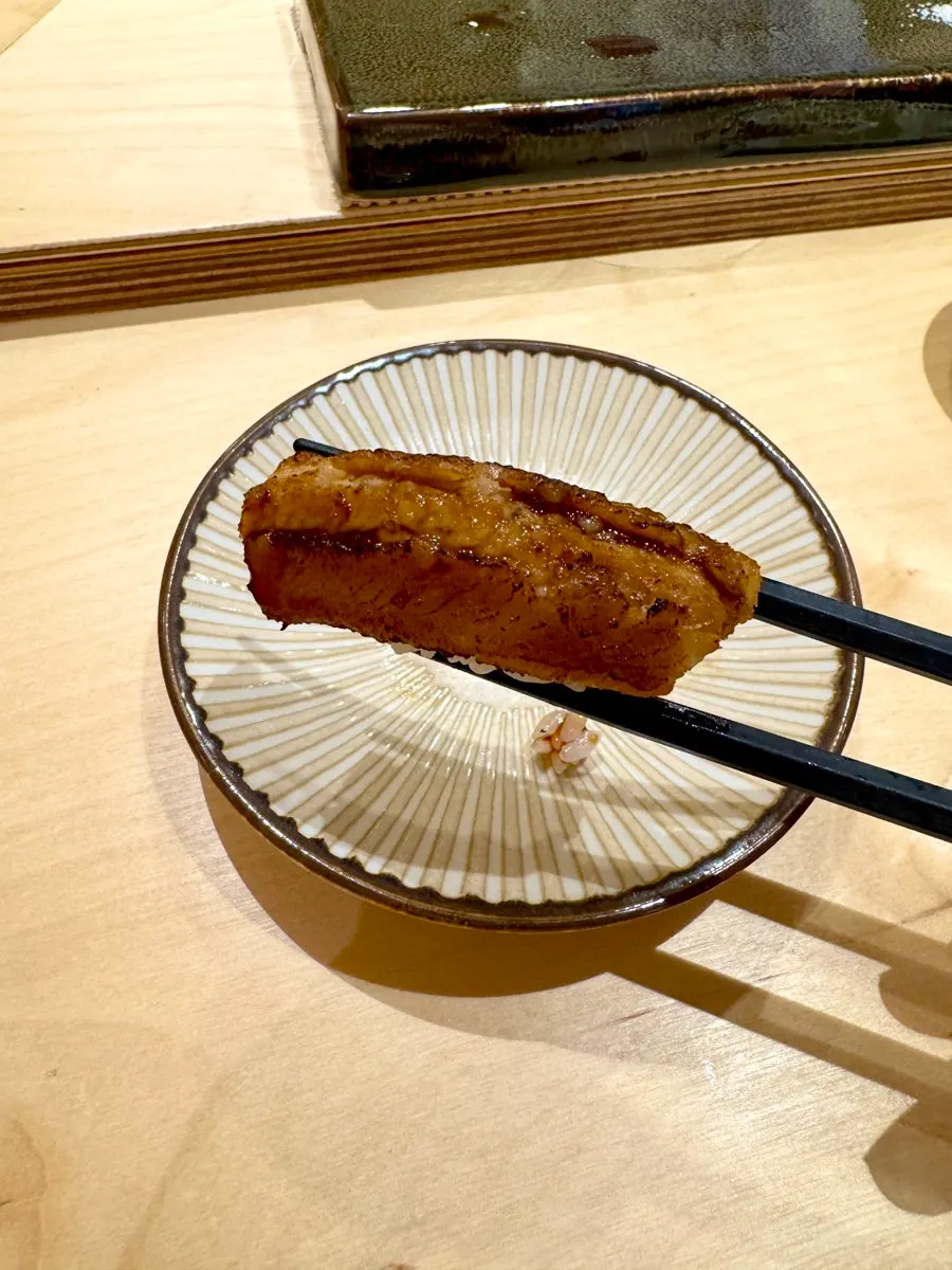 Close-up of a sushi piece from the course